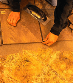 Man Installing Travertine Tile in Marietta and Roswell, GA Man Installing Travertine Tile in Marietta and Roswell, GA
